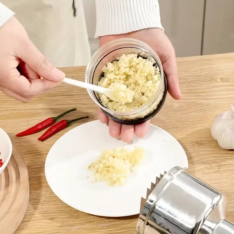 Käsitsi vajutatav küüslaugu ja sibula hakkija